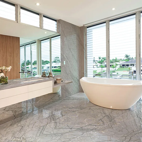 Large bathroom with natural stone flooring in Waianae HI